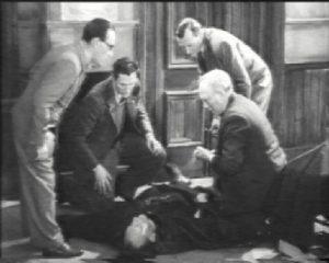 The station master falls to the floor dying