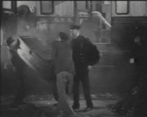 The supposedly dead station master is in the thick of it