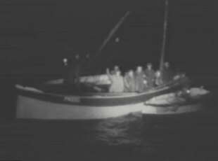 Sam Higgins and the others are rowed out to the North Stack rocks