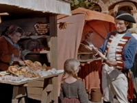 The soldier buys all the stall's sweets